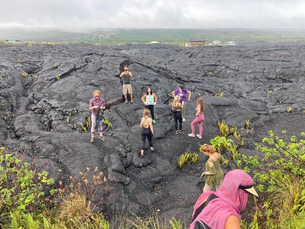 Sacred Ways group hiking across a Big Island lava field