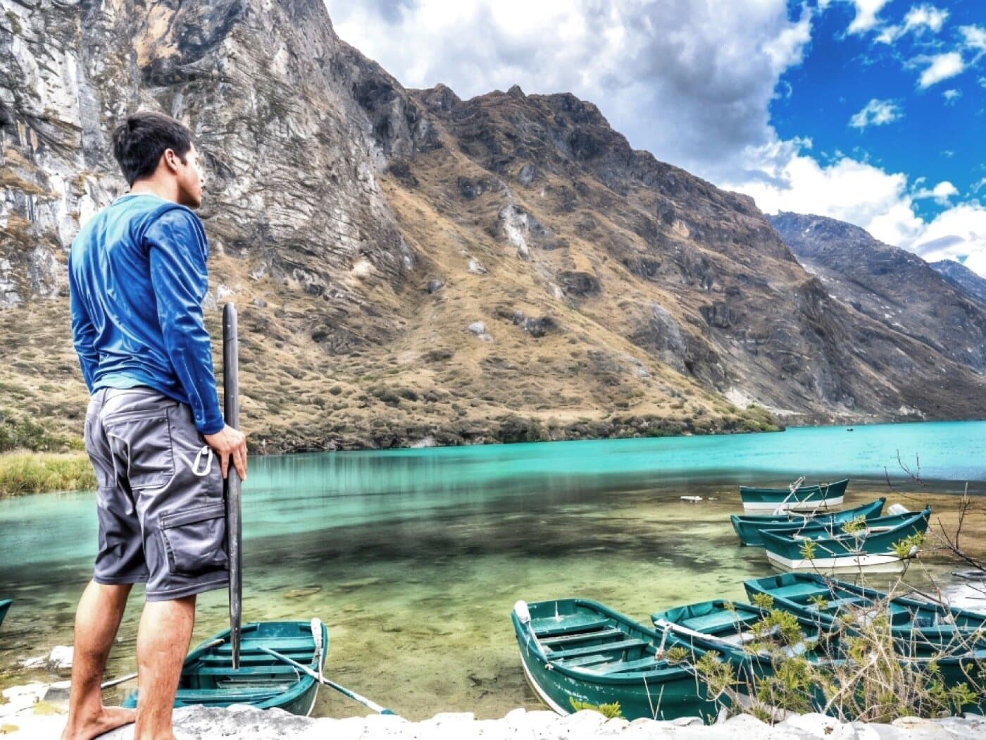 Solo figure at the turquoise alpine lake at Heaven's Gate