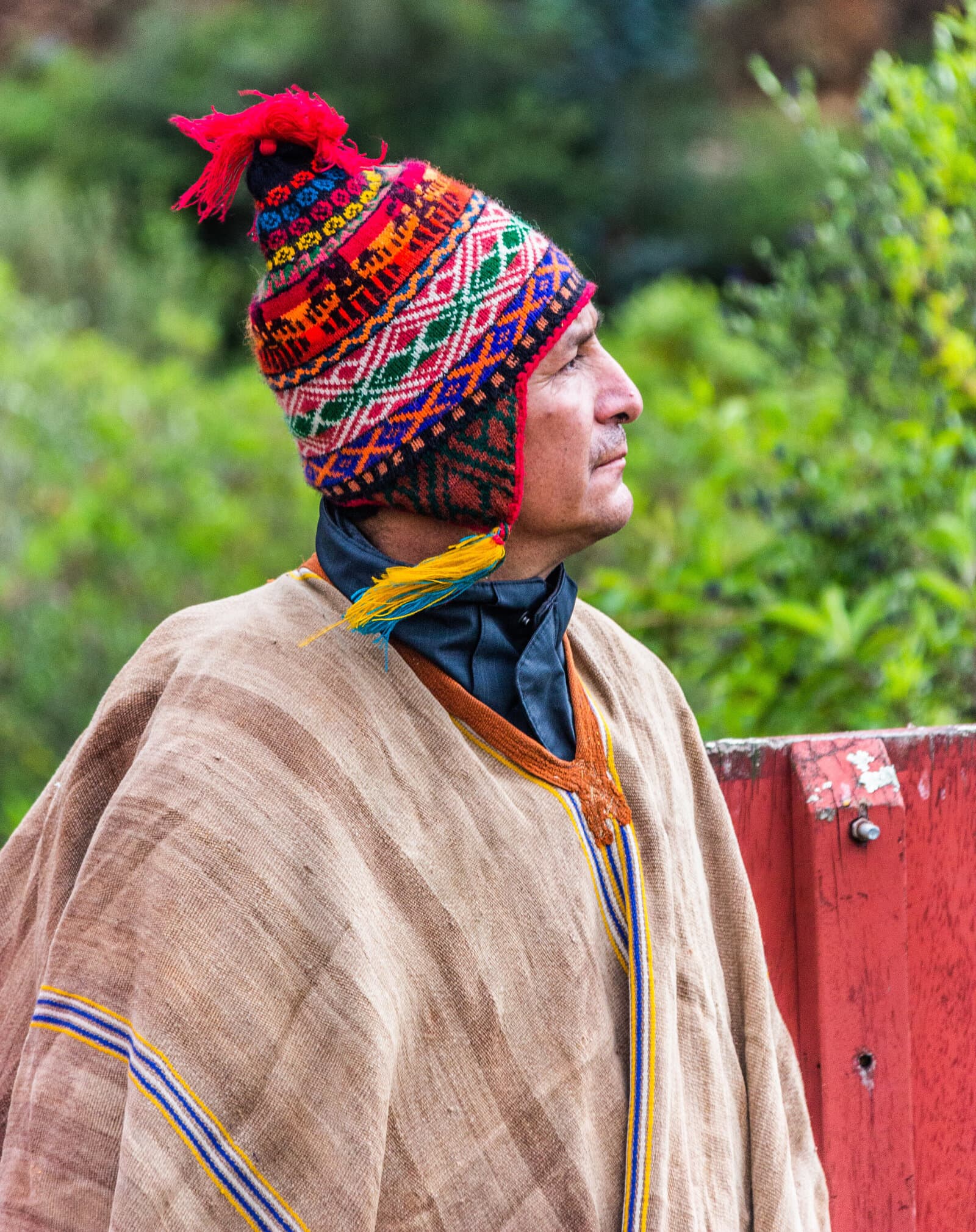 Don Martín in traditional Andean chullo and poncho