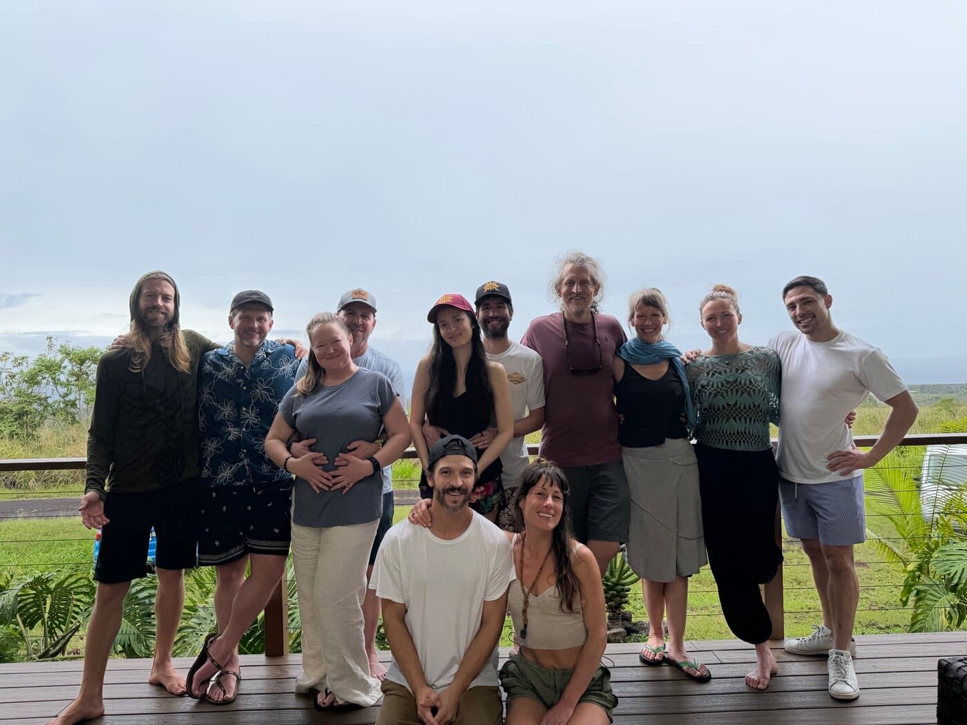 The full Sacred Ways Hawaii group gathered on the retreat deck overlooking the Big Island