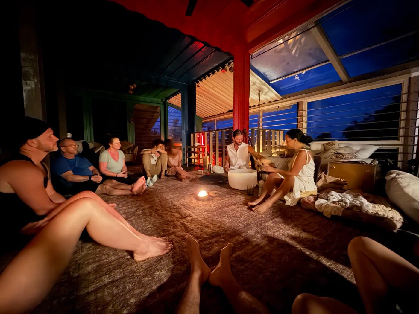 Sacred Ways evening ceremony circle in the shala, candlelit and intimate