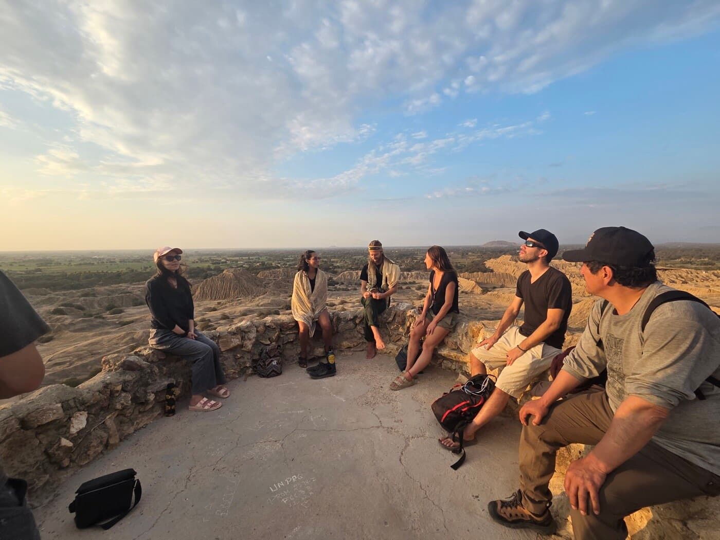 Group at Batán Grande overlook at sunset